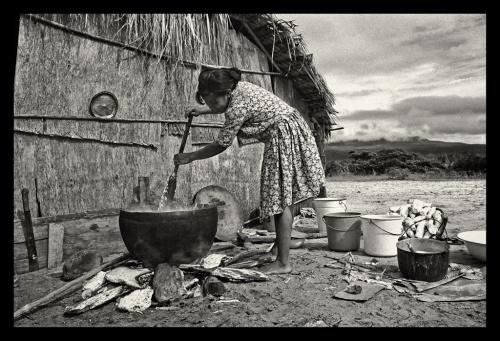 Akawaio woman stirs poisonous bitter cassava juice 
