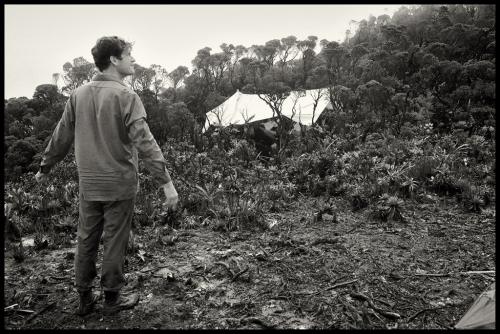 BBC film crew  soundman Gordon Forsyth baskes in momentary glimp of sunshine at Camp 7